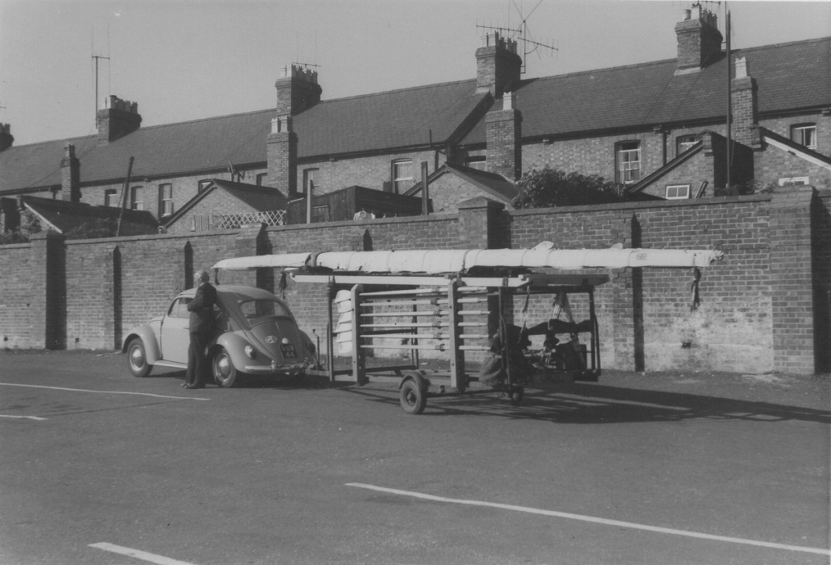 Beetle car with tiny boat trailer
