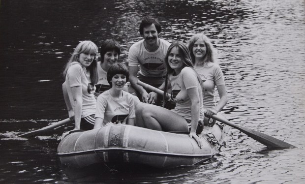 5 girls and their coach in an inflatable dinghy in CityLink t-shirts