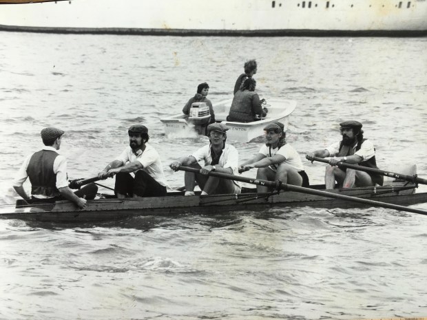 Coxed four in flat caps on the Tames