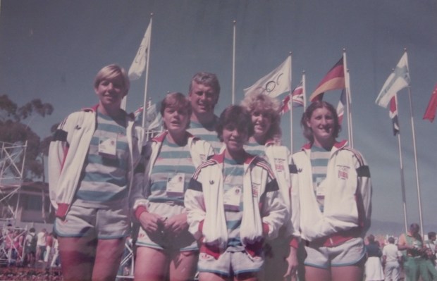 Crew and coach with flags behind