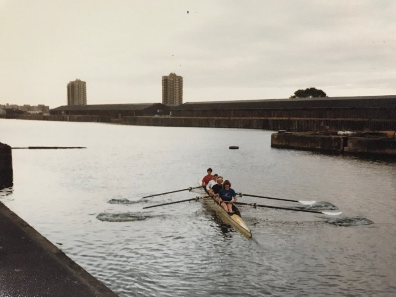 Rowing with warehouses in background