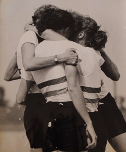 four women hugging after race