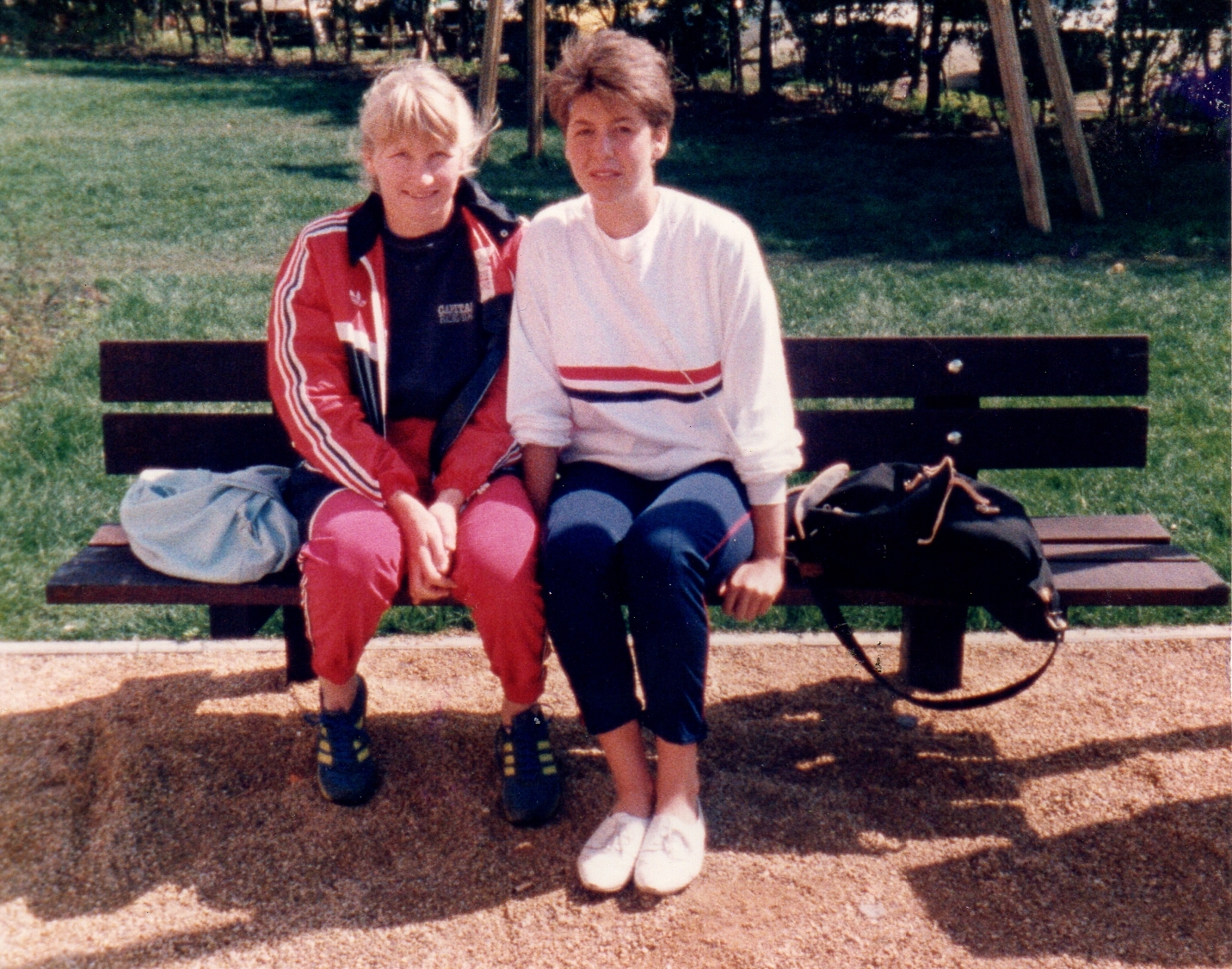 2 women in GB kit sitting on a bench