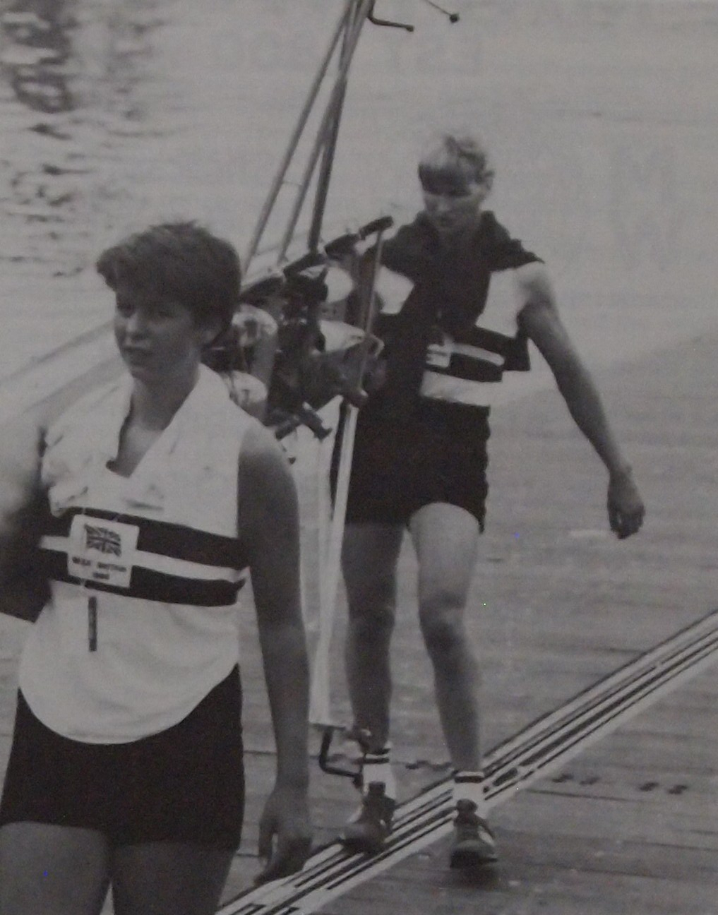 Two women carrying a pair