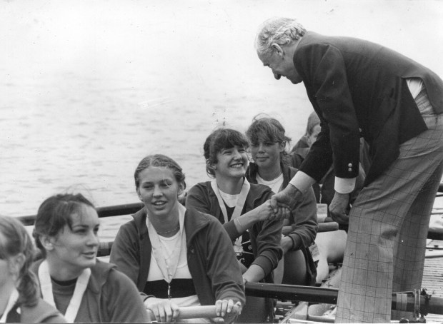 girls in an eight getting medals