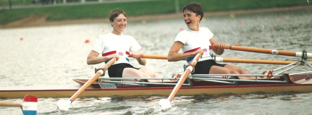 2 smiling women in double scull