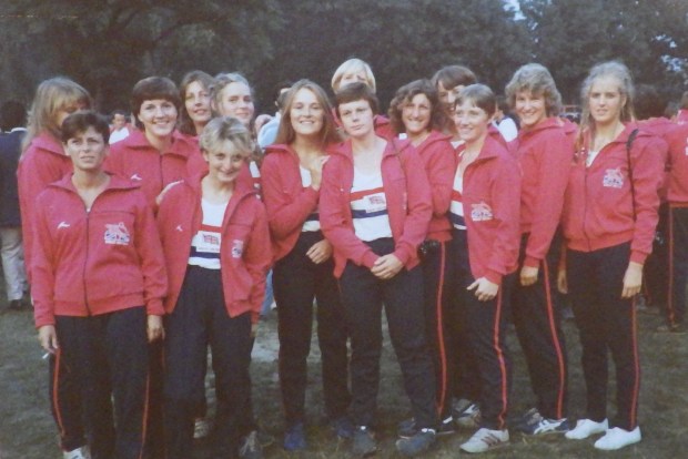 Women in red tracksuit tops