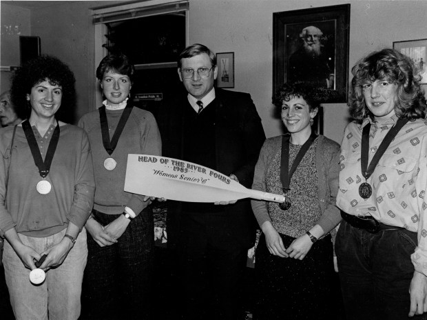 women being presented with medals and blade