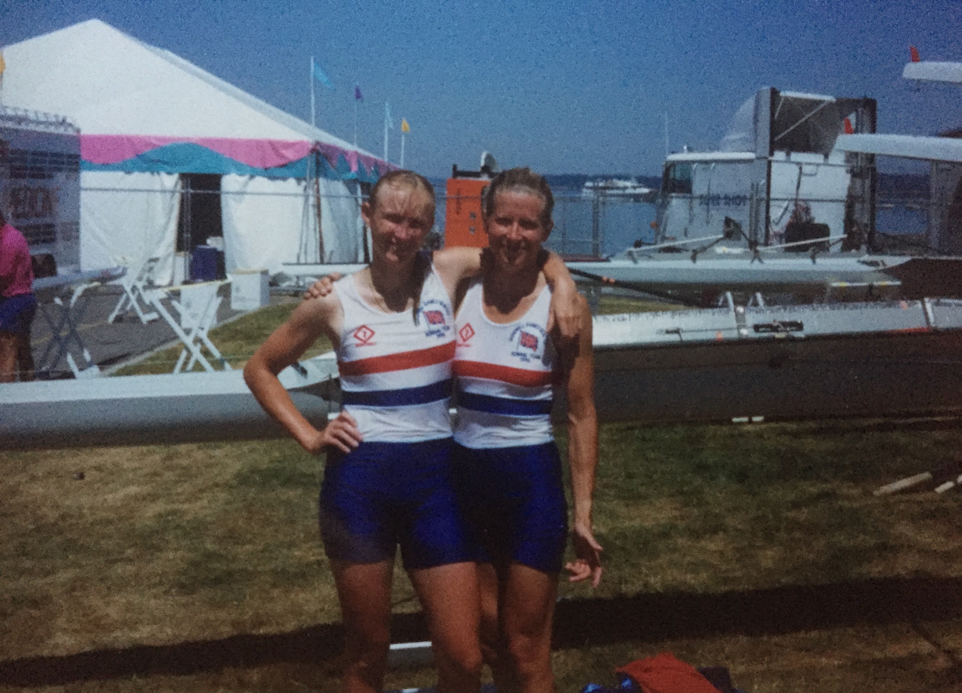 Two women with boats on trestles