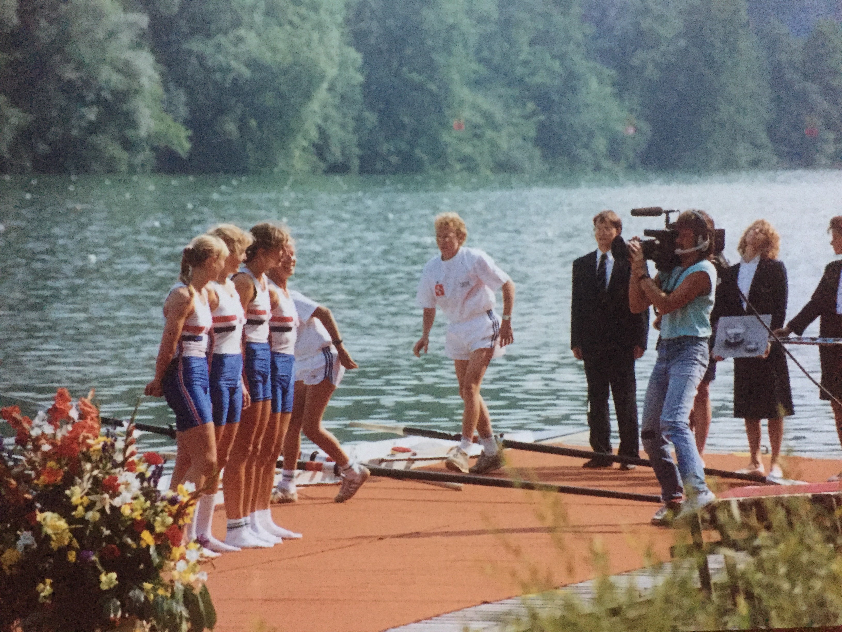 four women on pontoon being filmed by cameraman