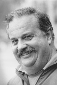 man with mustache smiling