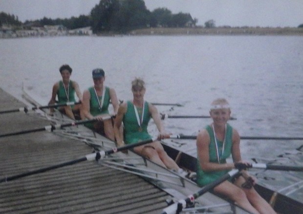 4 women in green lycra with gold medals