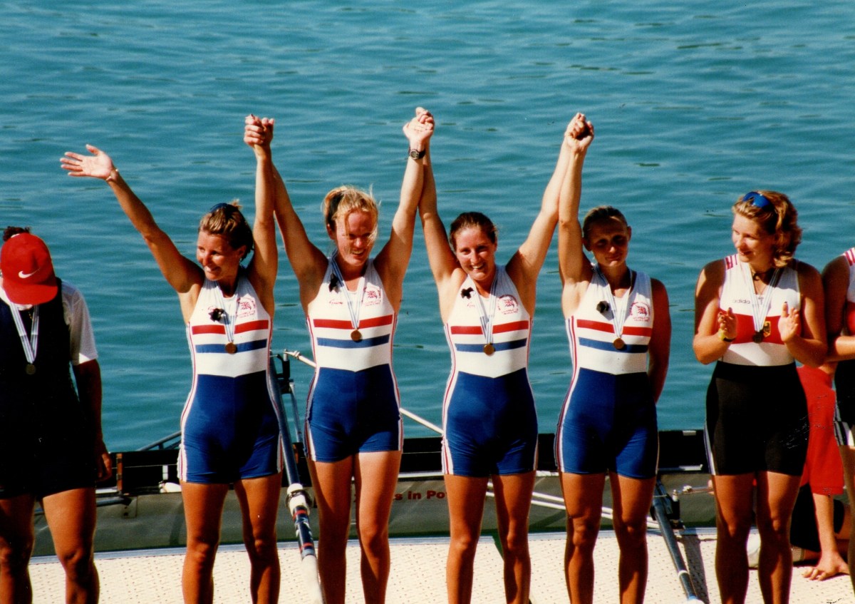 4 women with arms raised