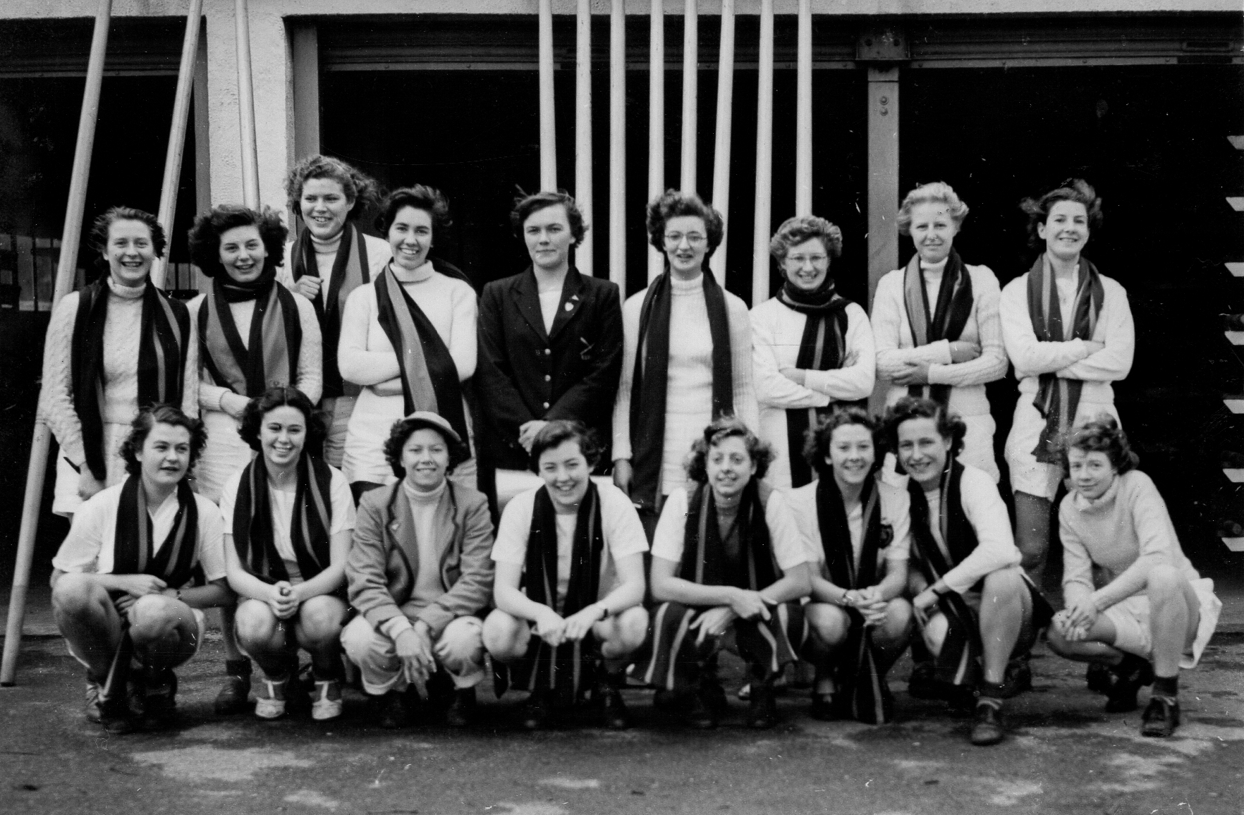 Women in college scarves and rowing kit