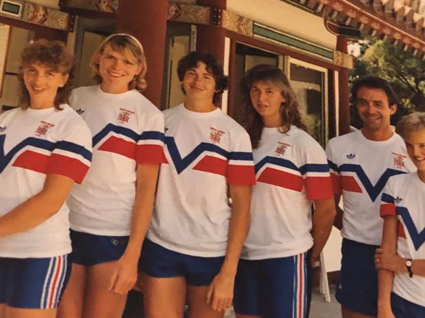 6 people in red, white and blue kit