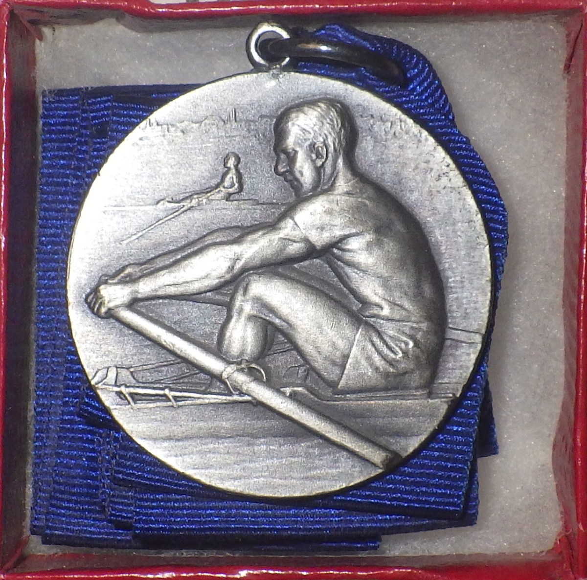 silver medal with blue ribbon