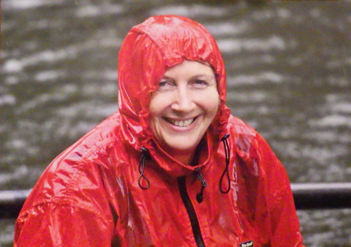 woman in wet red cagoule