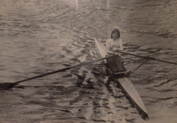 girl sculling - bw photo