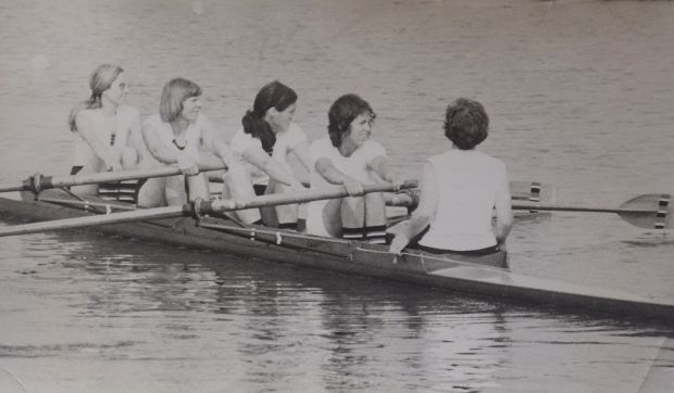 black and white photo of women's coxed four