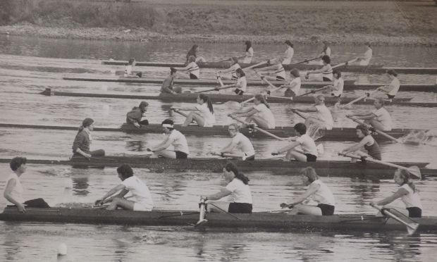 Black and white photo of 6 women's coxed fours racing