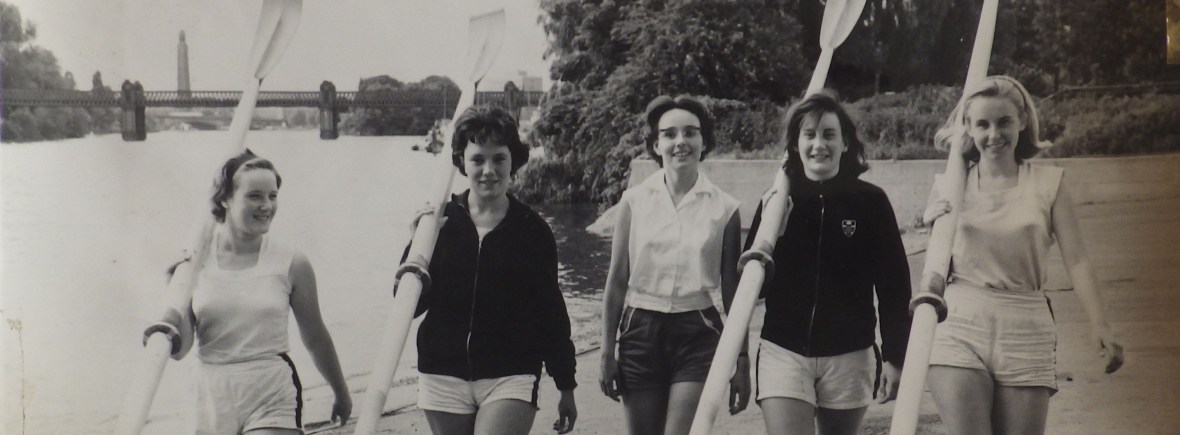 5 women carrying blades outside ULWBC with Kew Rail Bridge the background