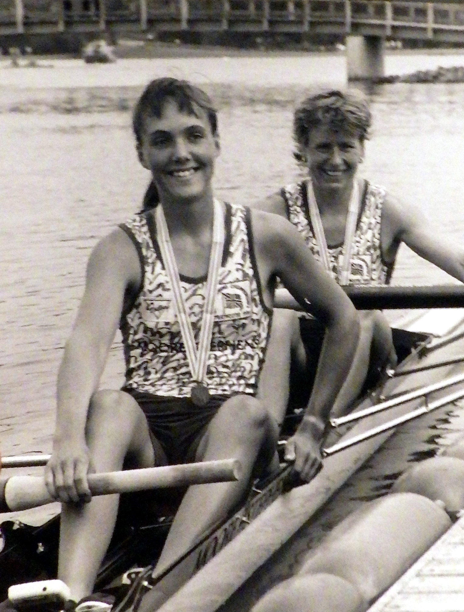 b/w photo of smiling women in pair