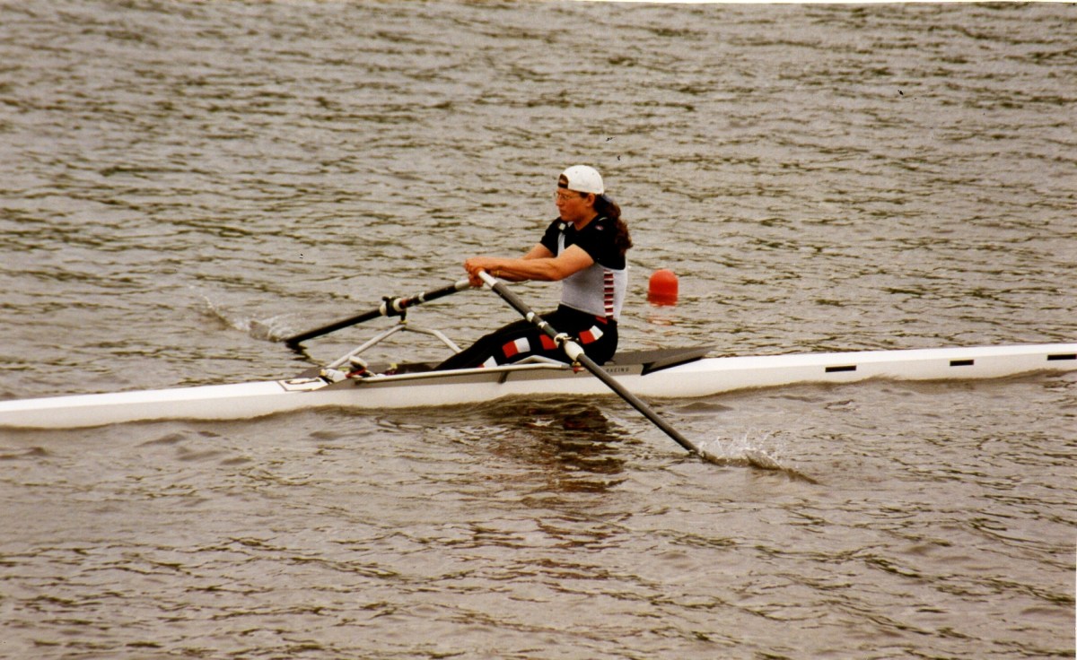 Woman sculler in Thames RC kit