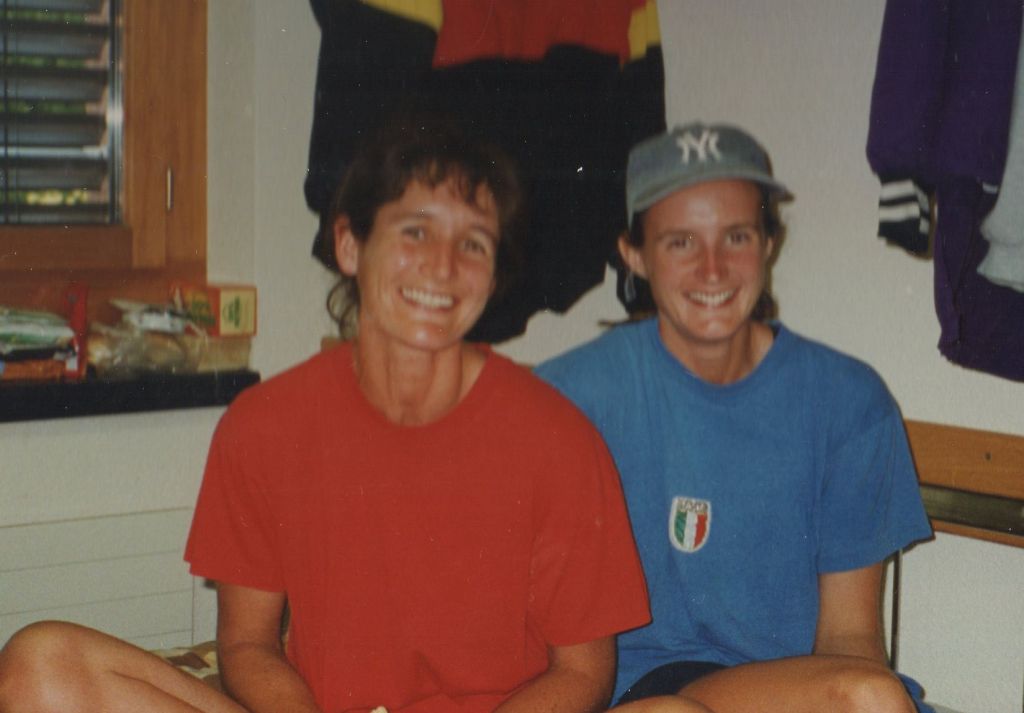 Two women in room full of rowing kit