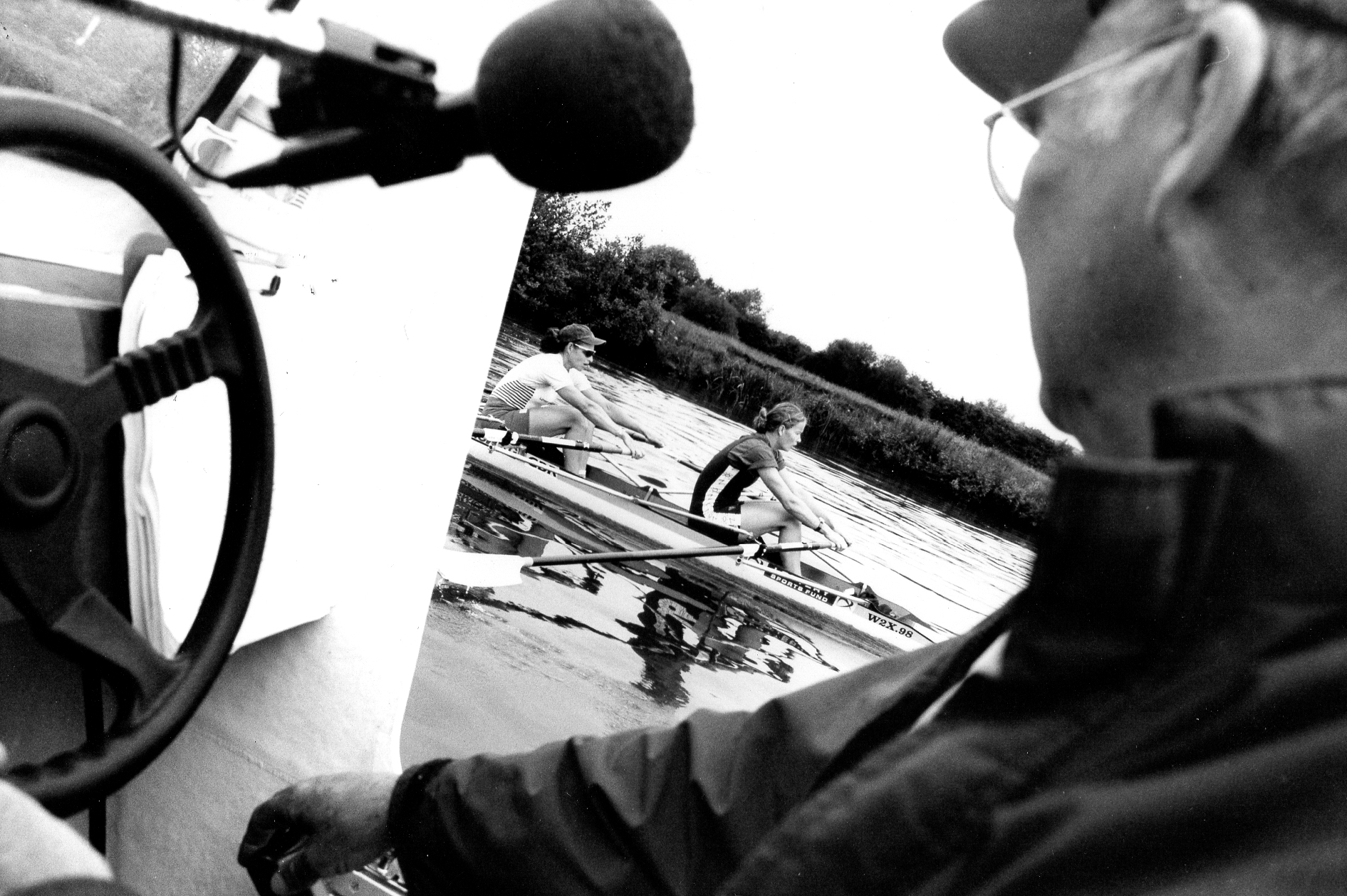 coach in launch and women's double scull b/w photo