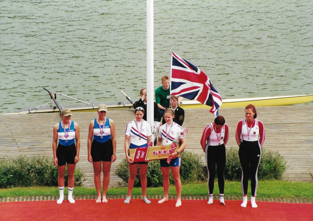 6 women with medals - 2 GBR  women in centre with Union Jack behind
