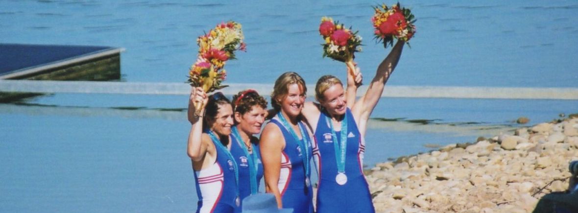 4 women at Sydney Olympics with silver medals and bouquets