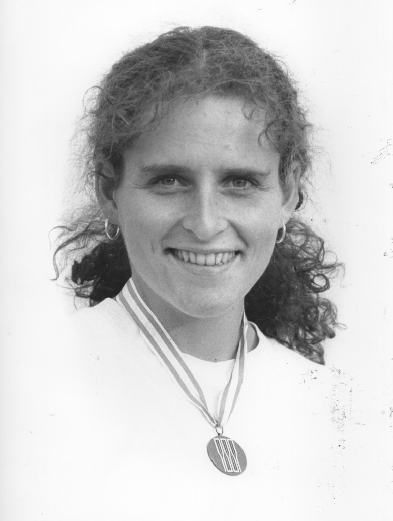 b/w photo of woman with medal round neck