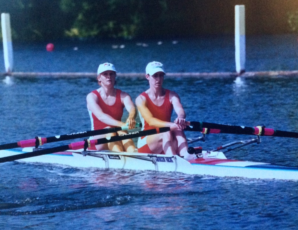 2 women in doubles cull in red kit