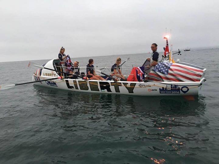 women in ocean rowing boat called Liberty