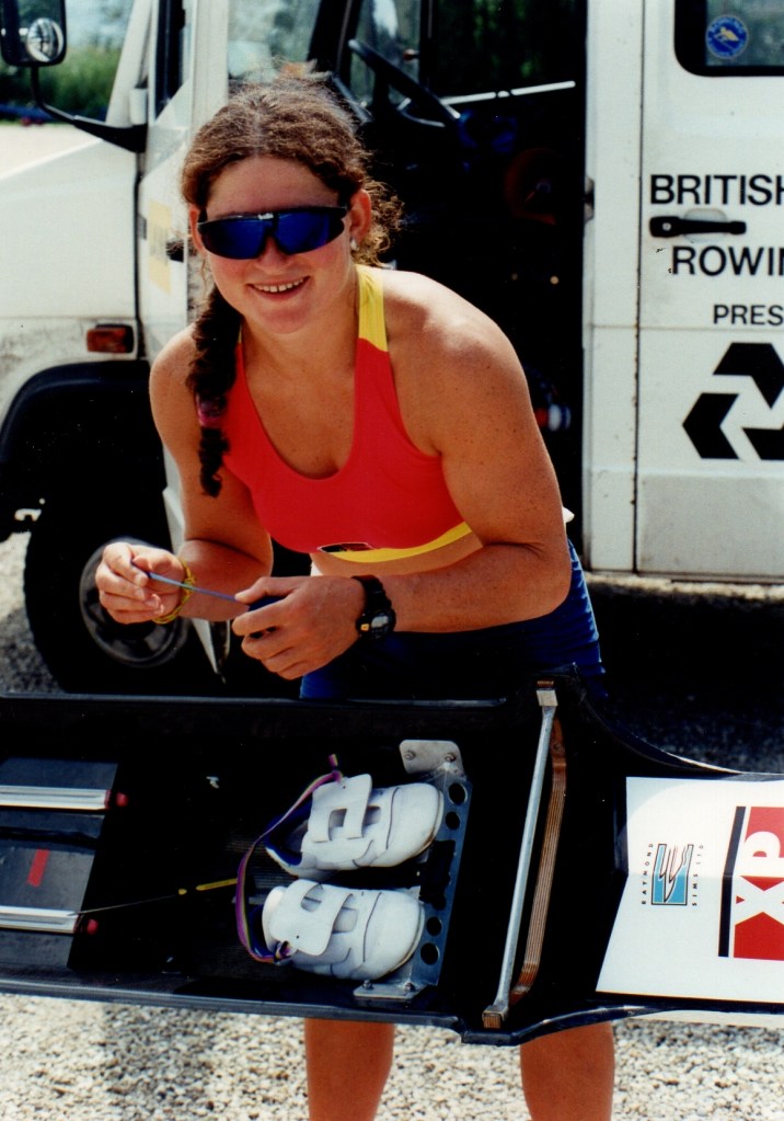 woman rigging single scull