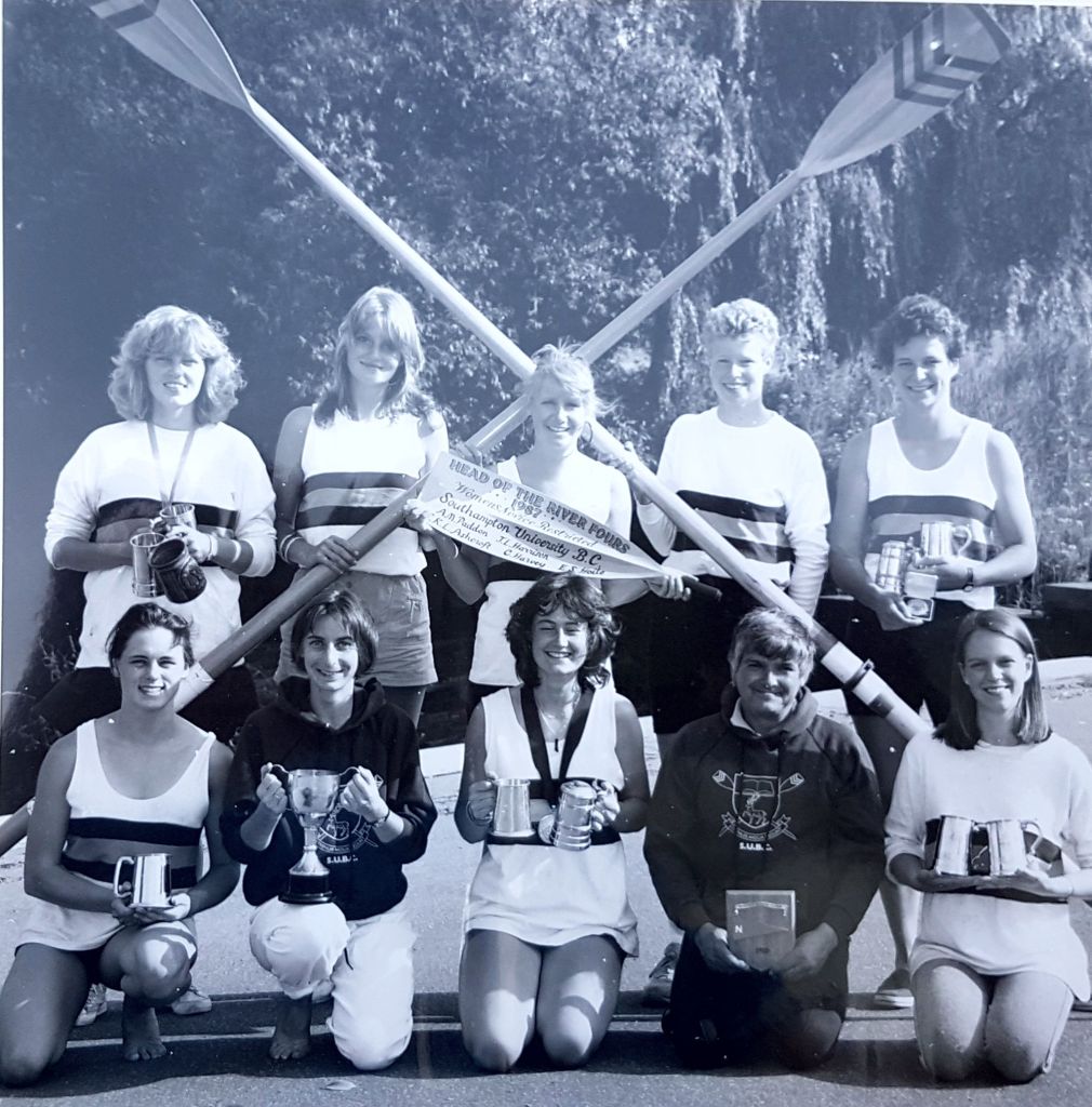 5 women in rowing kit celebrating