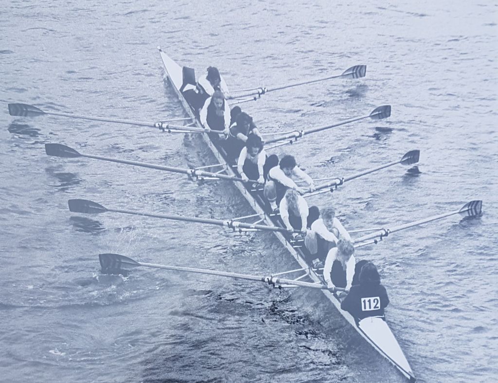 women's eight photographed from bridge overhead