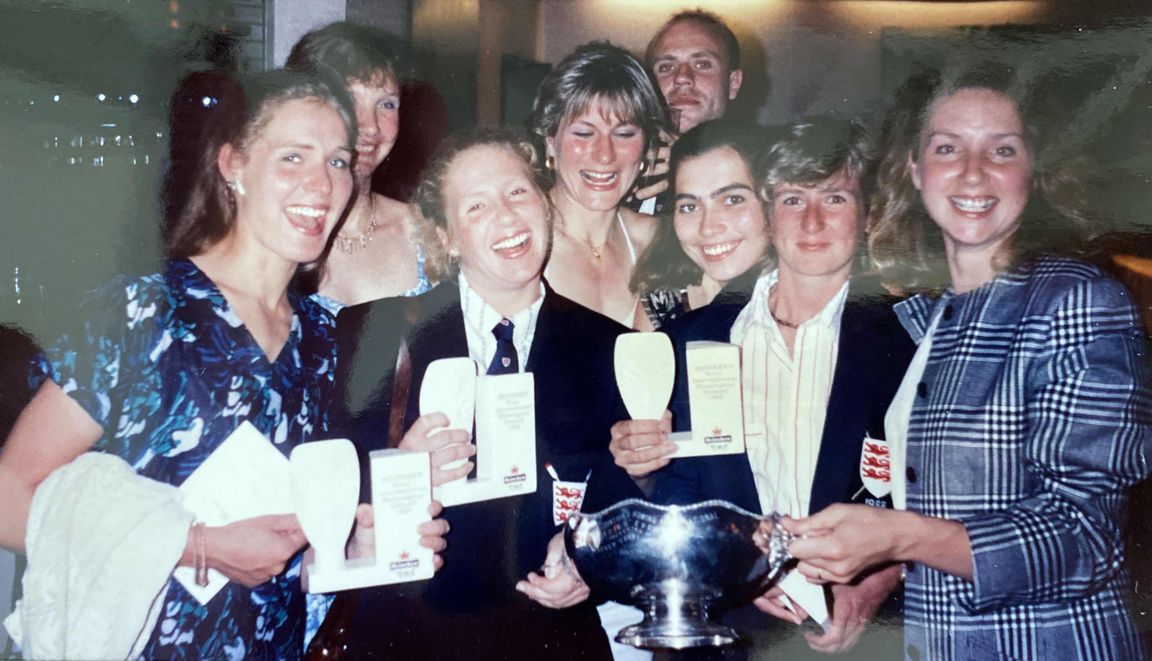 Group of women with large silver trophy