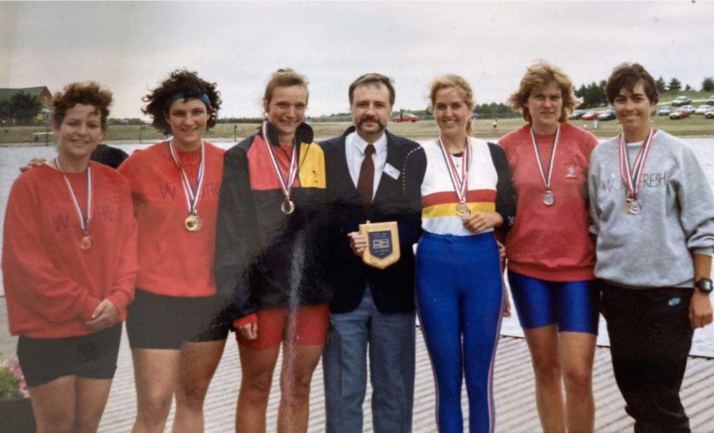 6 women with medals and man who has presented them