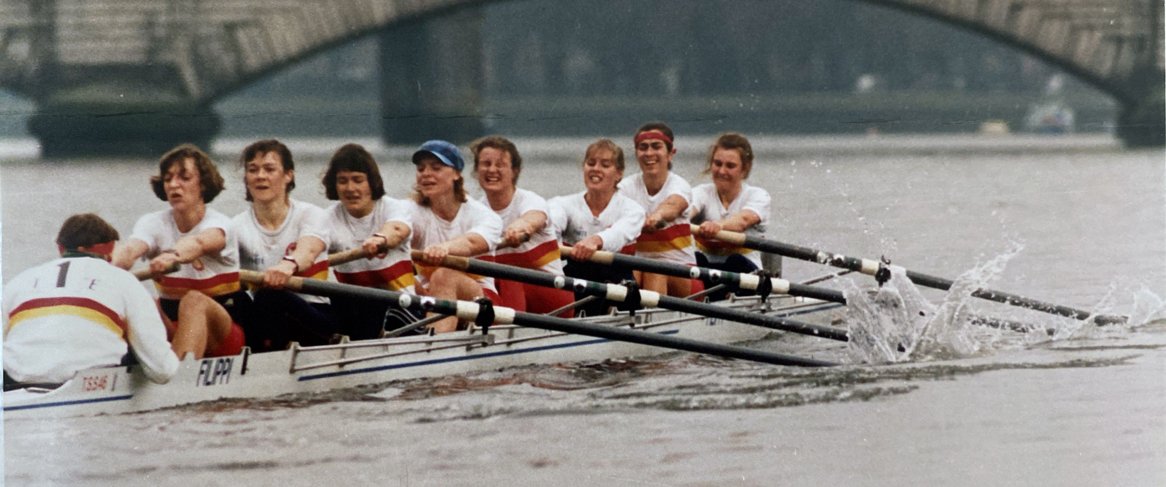 women's eight in red and yellow kit