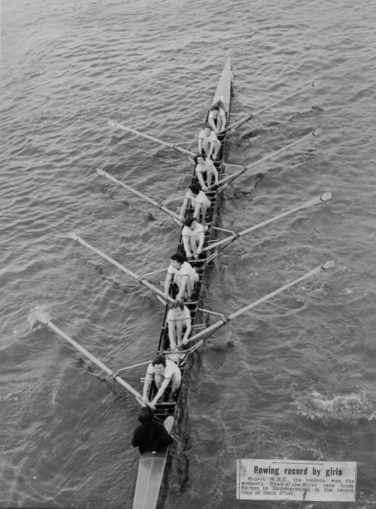 Women's eight photographed from a bridge